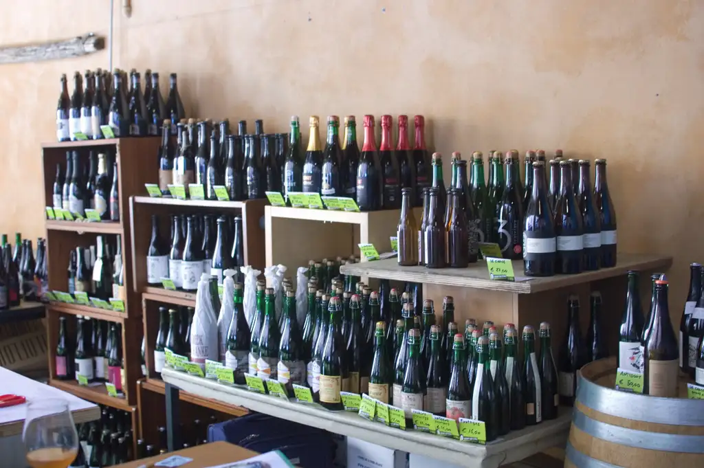 Specialist bottled beers displayed on tables at a drinks industry event.