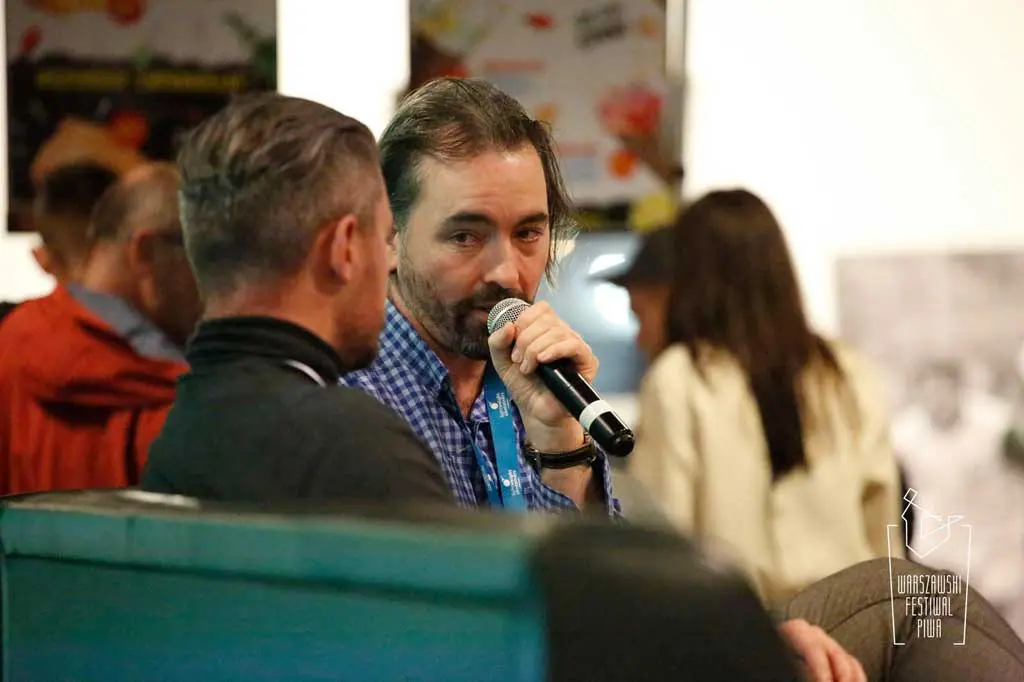 B Corp Consultant Peter speaking onstage about the drinks industry at Warsaw Beer Festival.